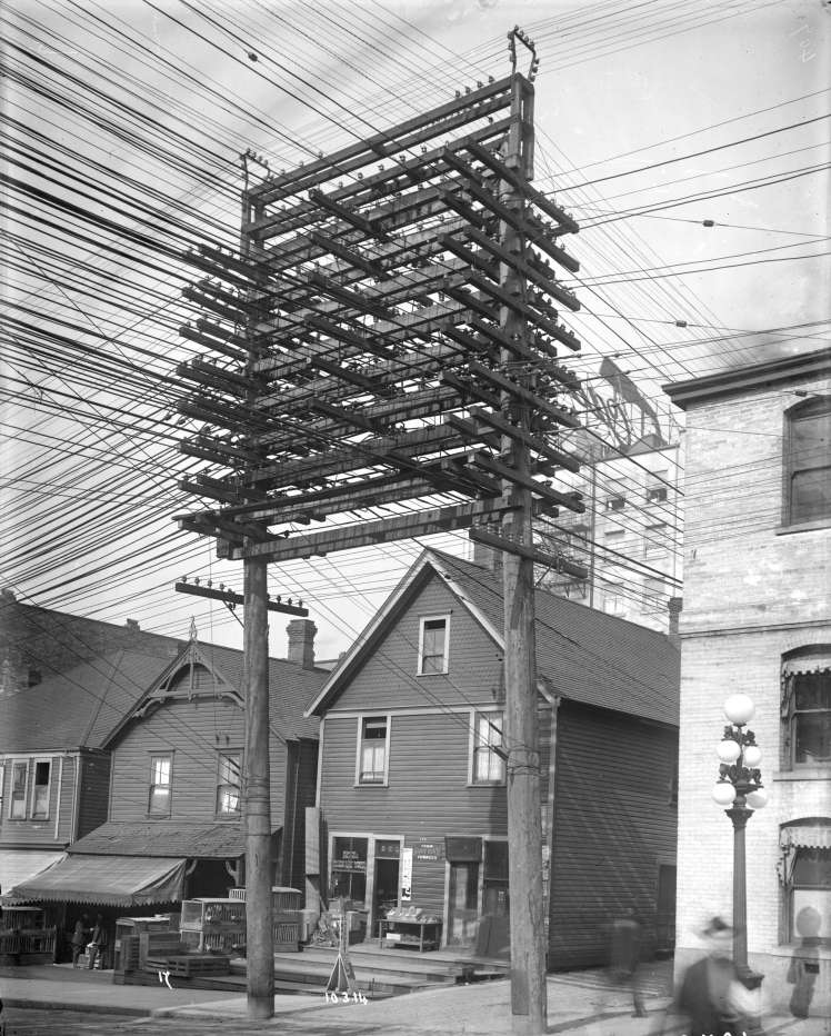 Power lines and supporting structure in lane west of Main Street at Pender Street. March 10 , 1914. Photo: British Columbia Electric Railway Company, CoV Archives, AM54-S4-: LGN 1241,